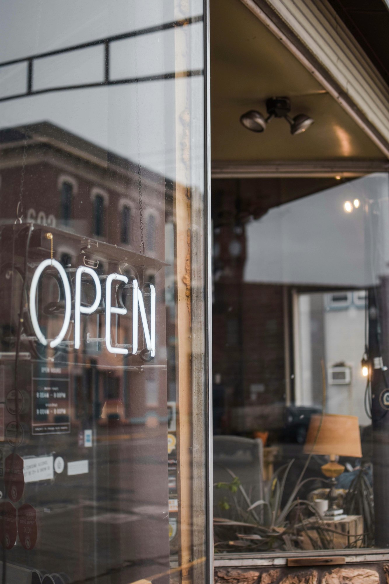 A picture of a storefront with an open sign. A picture of a storefront with an open sign.